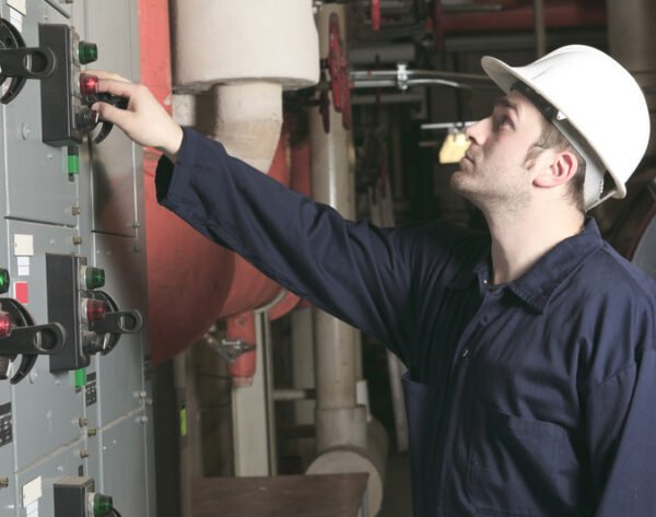 maintenance-engineer-checking-technical-data-of-heating-system